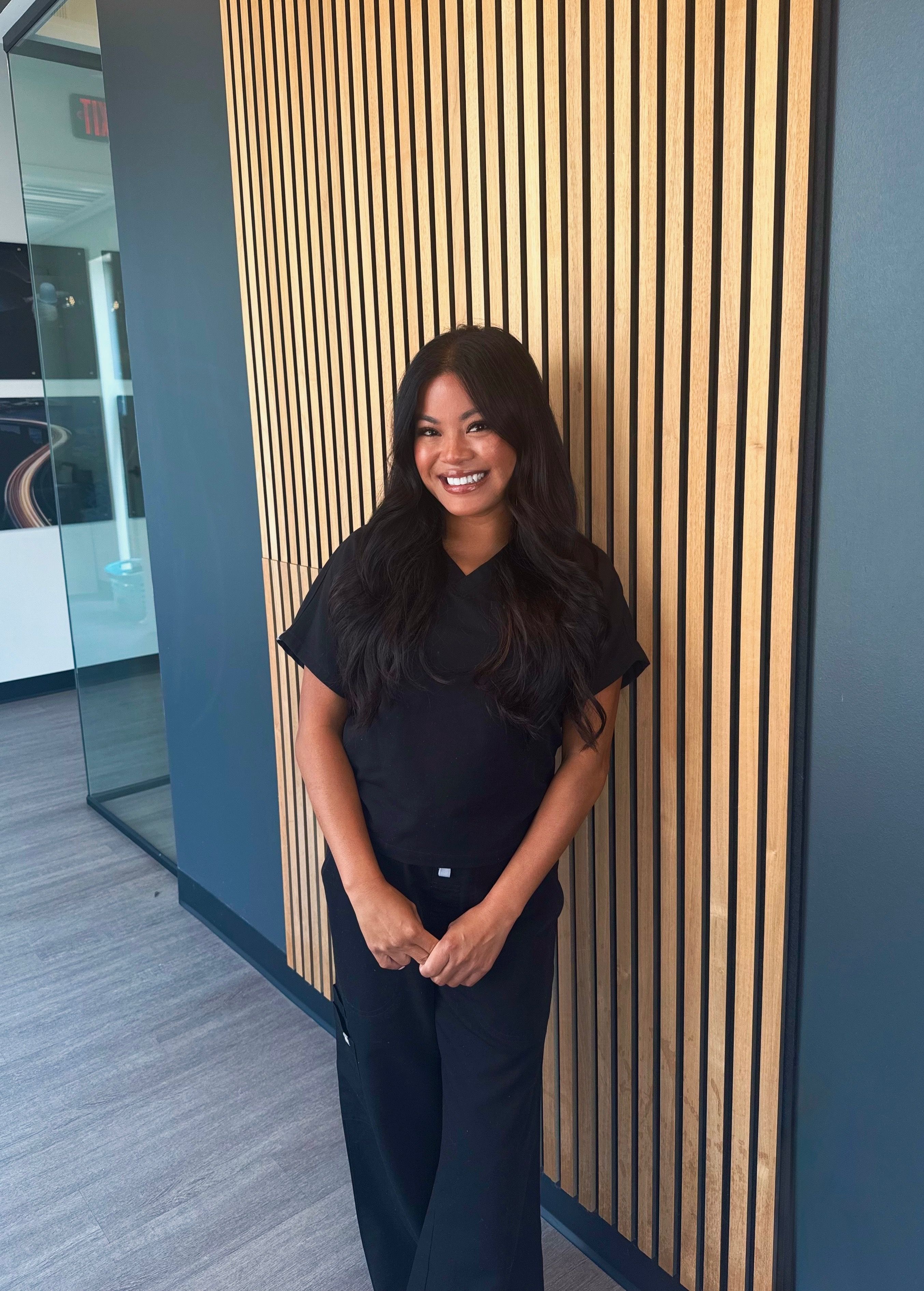 Licensed Aesthetician, Natalie Malicote, standing inside Valencia Medspa in Knoxville, TN